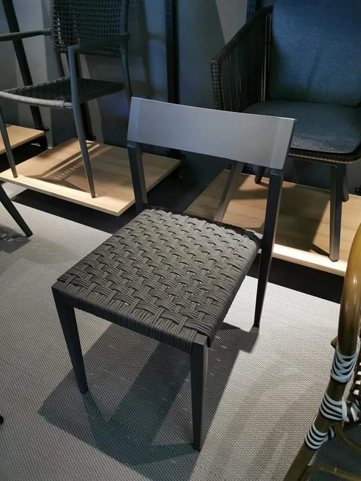 An aluminium outdoor chair with a woven seat