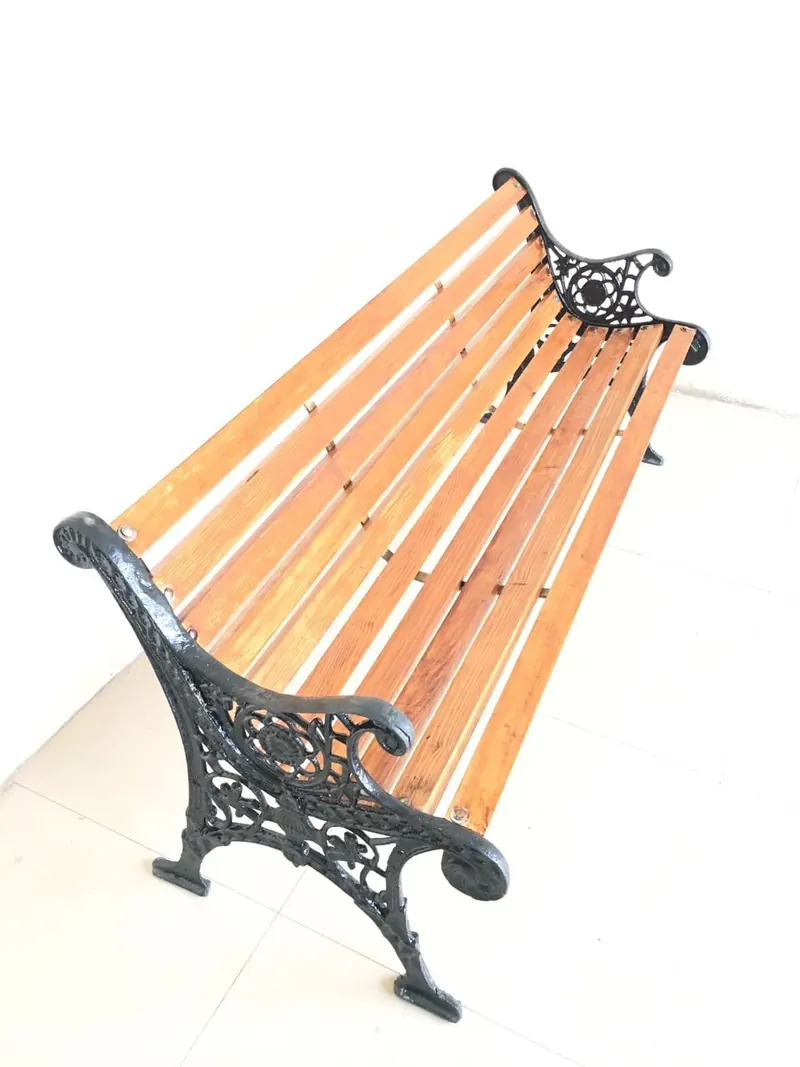 A wooden outdoor bench in the Wasi Craft showroom