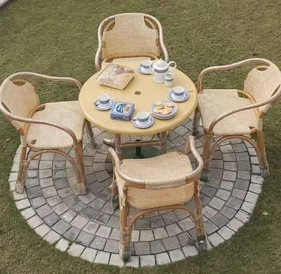 A rattan outdoor dining table and chairs